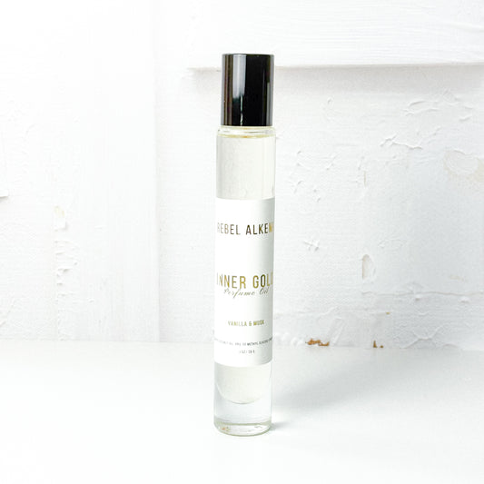 Inner gold perfume oil smells like vanilla and musk on a white background 