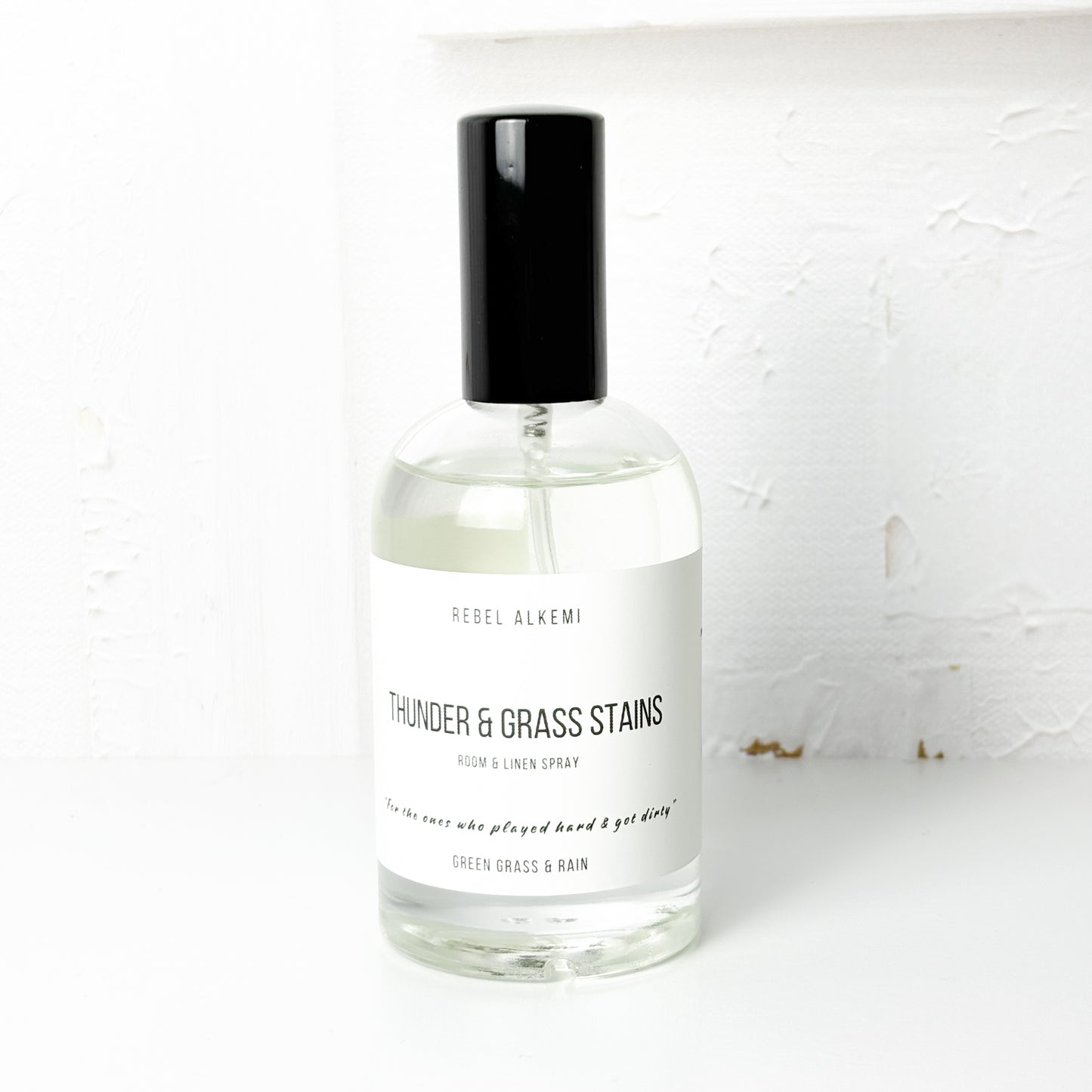 Thunder and grass stains room spray smells like green grass and rain on a white background 