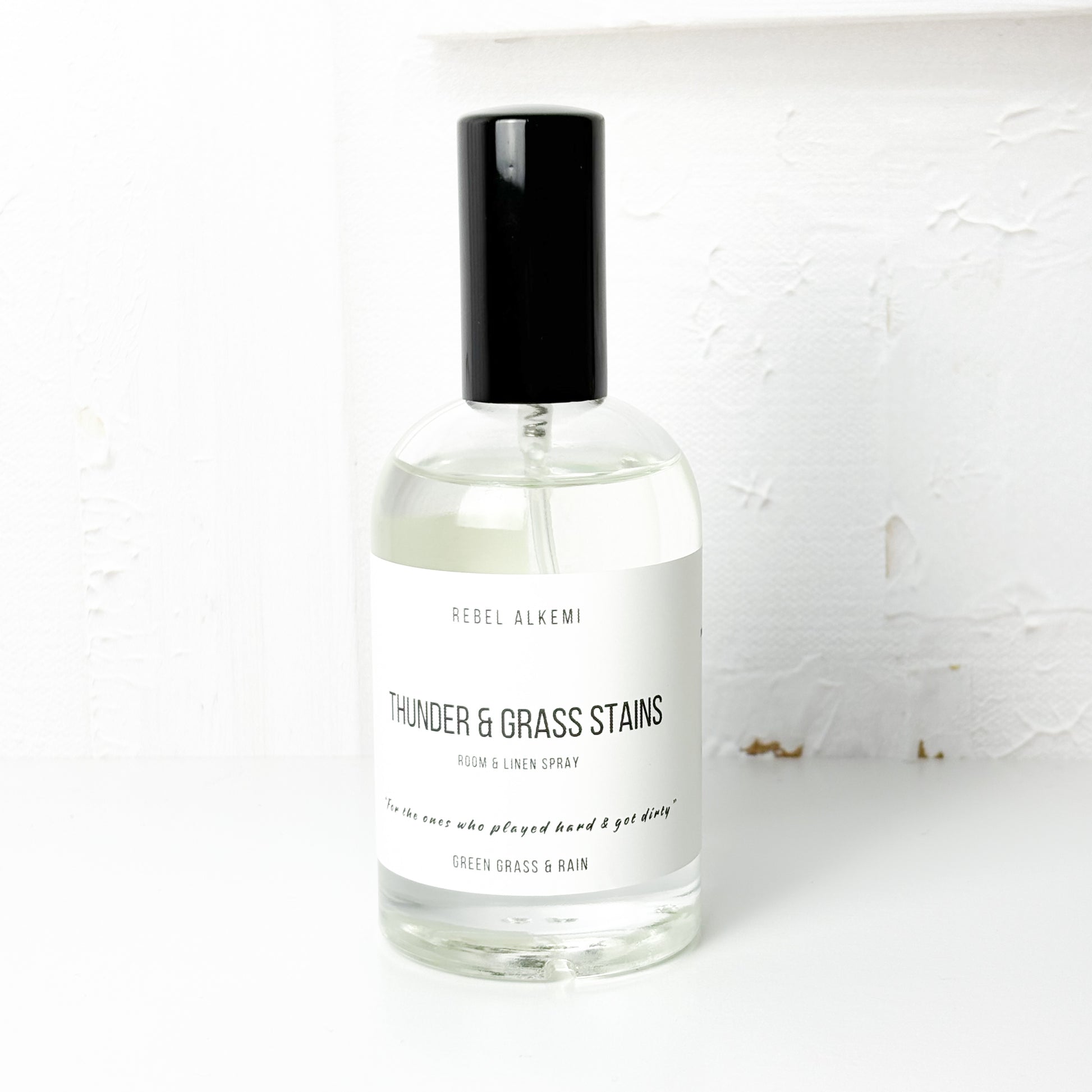 Thunder and grass stains room spray smells like green grass and rain on a white background 