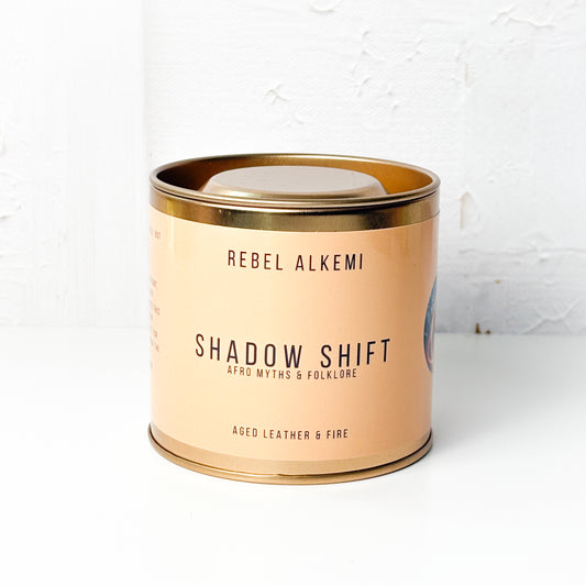 Shadow Shift Candle in a copper container with copper lid on a white background
